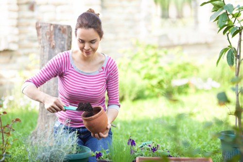 Gardener wearing protective equipment during maintenance work
